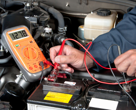 Man diagnosing engine of a vehicle